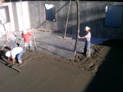 Concrete being poured & finished for structural floor
