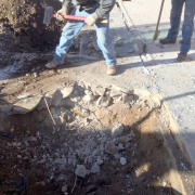 Removing concrete in atrium prior to excavation