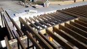 Floor joists dropped for brick floor at entry way