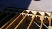 Joist reinforcement for exterior wall under trusses