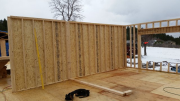 Long interior wall sheathed for extra shear capacity