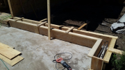 Concrete forms between garage and porch