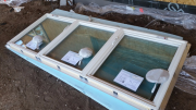 Windows are unwrapped on foam for care in handling