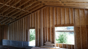 Tall garage and school room walls are framed.
