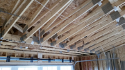 Garage girder with hangers.