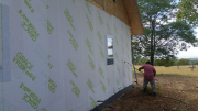 Carlos applying new Grace fully-adhered vapor permeable weather resistive barrier