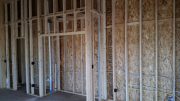 Tall interior walls are framed in school room