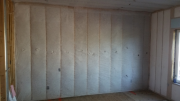 Interior master bedroom wall insulated