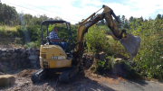 Chuck removing tree stumps