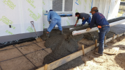Placing concrete at rear patio