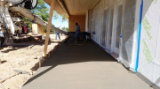 Completing placement of concrete at rear patio