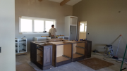 Steve setting kitchen cabinets