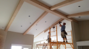 Installing beams in family room and kitchen