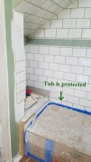 Bath tile installation in progress