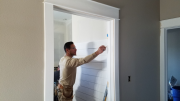 Steve installing shiplap at main bath