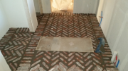 Mudroom brick floor is grouted