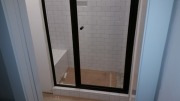Shower door in boys' shower is installed