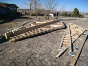 Roof trusses are organized and gables sheathed on ground