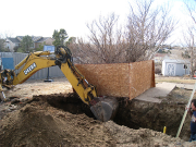 Chuck is digging foundation trenches