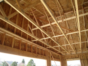 Garage roof trusses are braced and sheathed