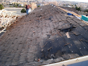 Old cedar shingles are removed