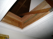 Old attic acces retrofited with insulation barrier