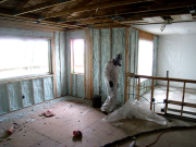 Insulation technician wearing protective gear