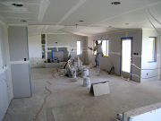 Living room drywall being taped