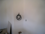 Relocated wiring for sprinkler control in garage