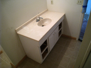 Basement bath existing cabinet & top are re-installed