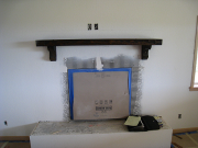 Existing mantle re-installed above new fireplace