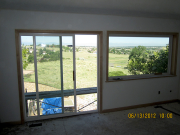 Windows in master bedroom are trimmed