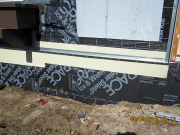 Flashing for future concrete patio by entry
