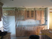 Cabinets are protected before painting
