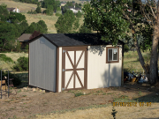 Existing shed is painted and has a new roof