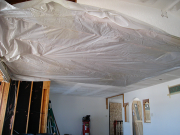 Kitchen ceiling is covered with plastic to keep heat in