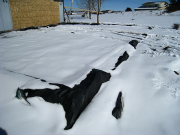 New garage slab is covered with blankets and snow