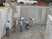 Off loading and spreading concrete for basement