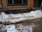 Blankets protecting ground before concrete pour