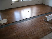 Engineered hardwood floor installation in great room in progress
