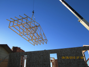 trusses being lifted by crane