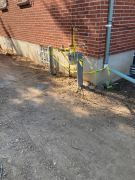 Bollards in place to protect gas meter