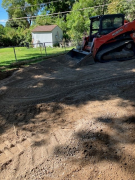 Driveway road base being leveled