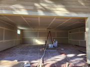 New garage floor is protected & drywall installed