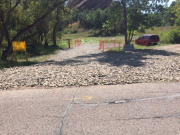 Tracking pad at asphalt end