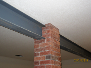 Brick column wraps around steel beam