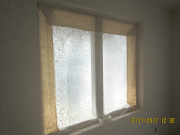 Windows are protected from drywall texture spray