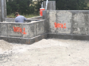 Foundation wall marked for underground plumbing