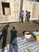 Placing concrete for basement floor