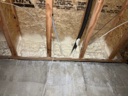 Closed cell foam at ledger box sill adjacent to garage wall